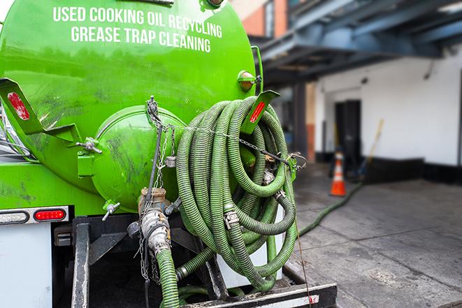 maintenance crew pumping grease trap at a fast food restaurant in Ash Fork, AZ